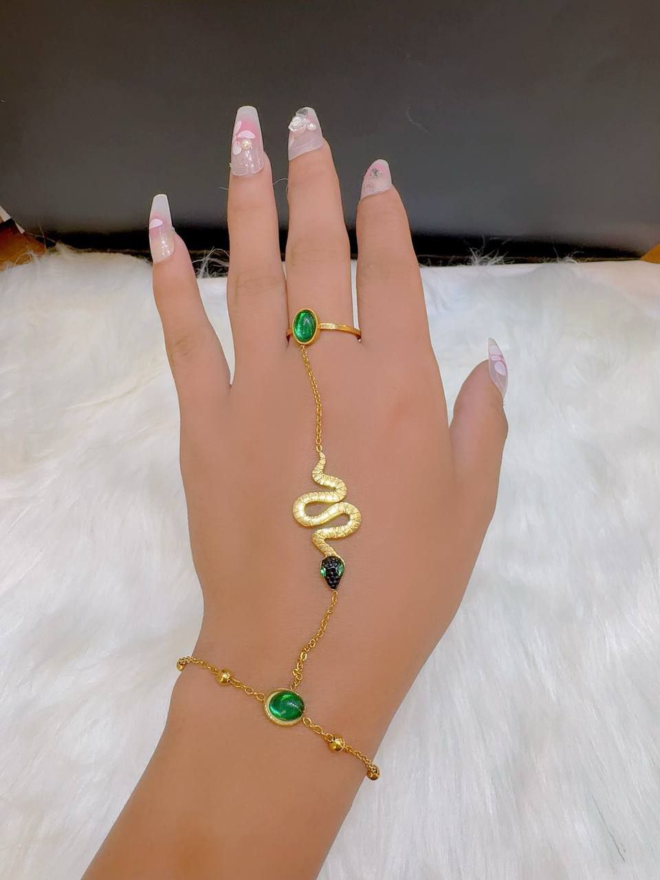 The most beautiful ring and snake chain with chic green lobes has arrived