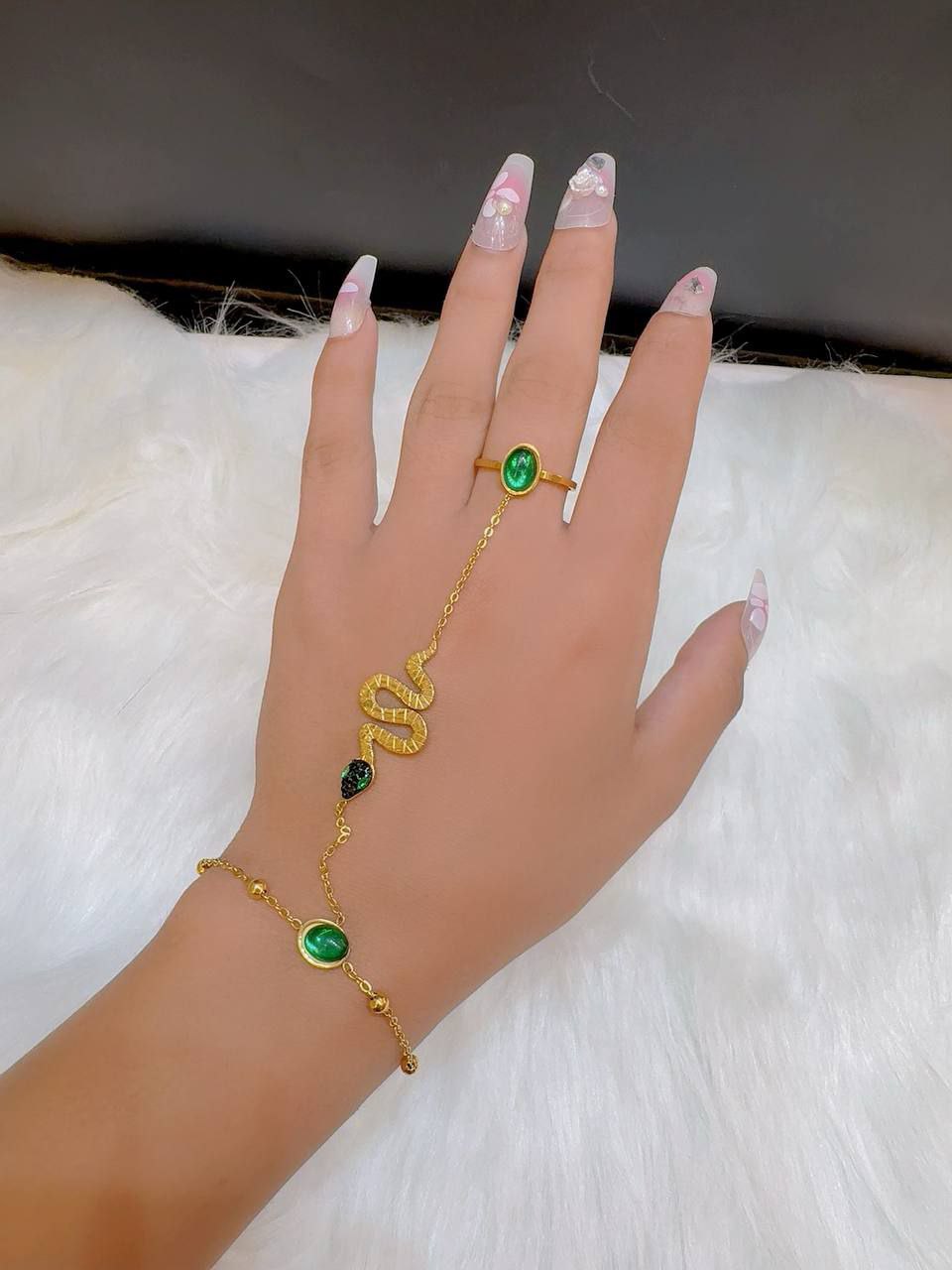 The most beautiful ring and snake chain with chic green lobes has arrived